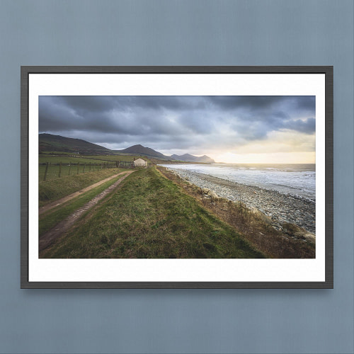Aberdesach Coastal Path Photography Print - Stormy Skies and Sunlit Mountains